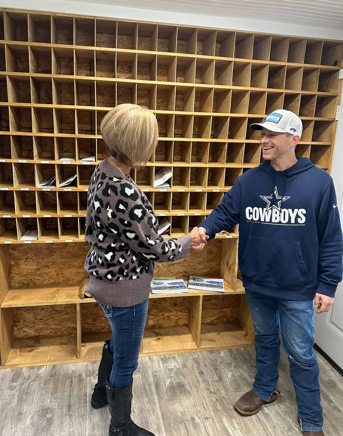 Texas Star RV Community manager Tanya Ott shaking the hand of a guest.